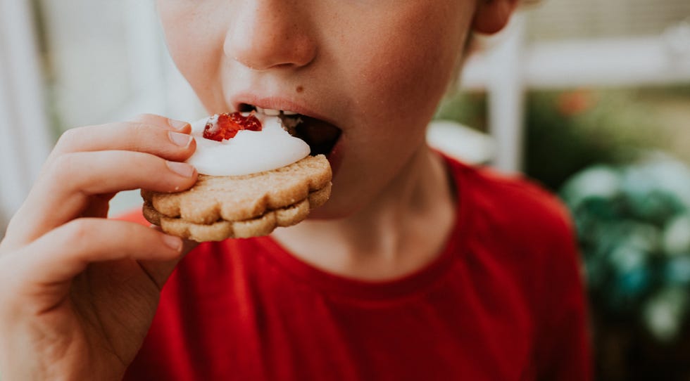 boy eating a german biscuit