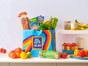 a shelf with various fruits and vegetables