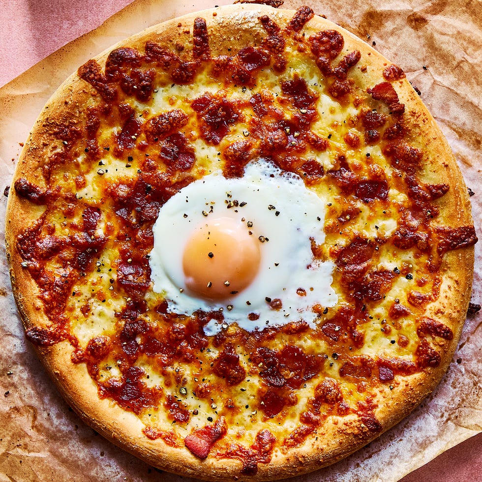 pizza with an egg baked in the middle