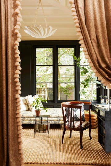 a daybed covered in linen in the upstairs sitting room