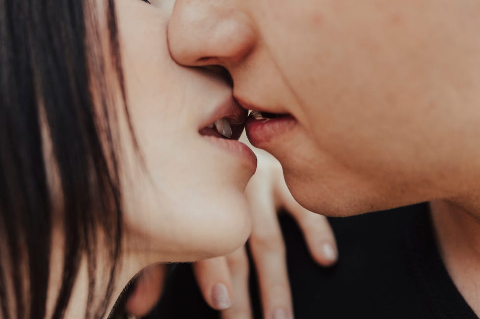 close up of middle eastern couple kissing