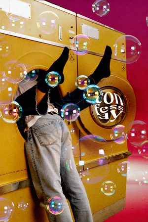 a woman's legs sticking out of a washing machine