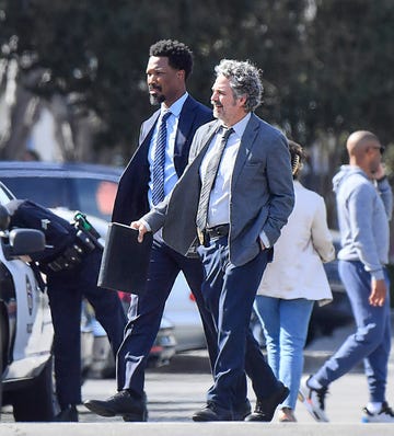 corey hawkins, mark ruffalo walking down the street in calabasas, california while filming for crime 101