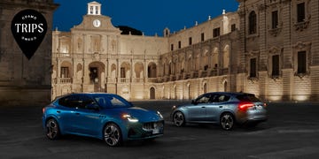 two cars parked in front of a building