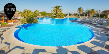 a pool with chairs around it