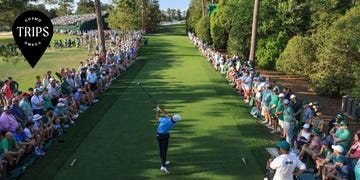 a person swinging a golf club