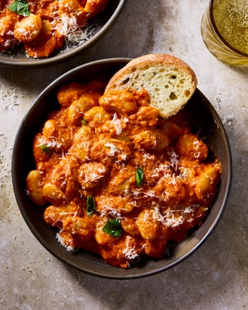 butter beans alla vodka in a bowl with toast