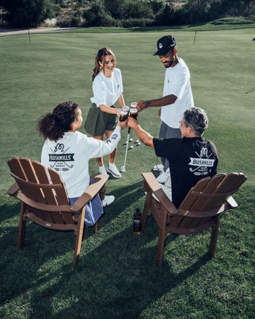 a group of people playing golf