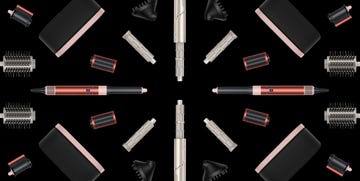 collection of hairstyling tools arranged symmetrically on a black background