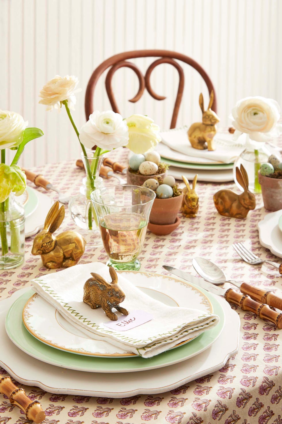 brass bunnie used on an easter table as place card holders and down the center of the table as a centerpiece