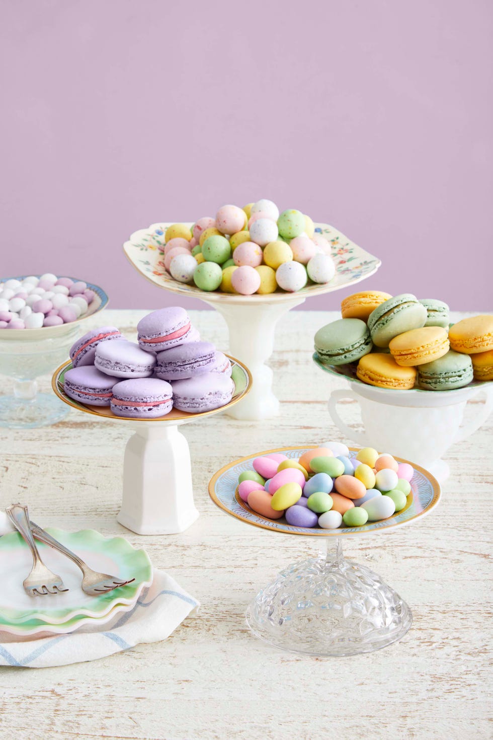 candy dishes made from decorative plates and bowls perched on upside down candle sticks and sugar jars