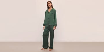 model wearing green loungewear set against a light background