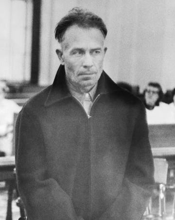 ed gein looking up at the judge as he stands in court