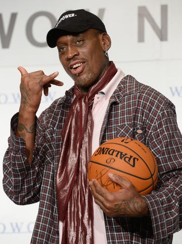 dennis rodman on red carpet with basketball