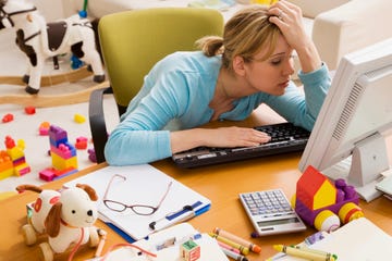 frustrated hispanic woman at desk surrounded by toys