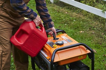 a person pushing a lawn mower