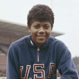 wilma rudolph in a blue usa zip up sweatshirt