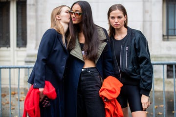 paris, france october 01 models seen whispering outside chanel during paris fashion week womenswear spring summer 2020 on october 01, 2019 in paris, france photo by christian vieriggetty images