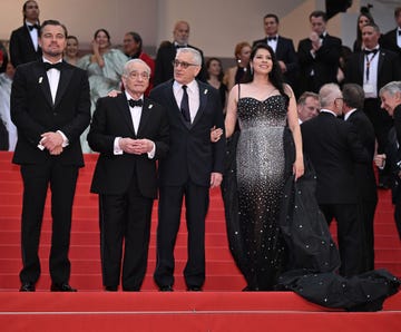 cannes, france may 20 l to r us actor leonardo dicaprio, us director martin scorsese, us actor robert de niro and us actress cara jade myers arrive for the premiere of the film killers of the flower moon during the 76th edition of the cannes film festival at palais des festivals in cannes, france on may 20, 2023 photo by mustafa yalcinanadolu agency via getty images