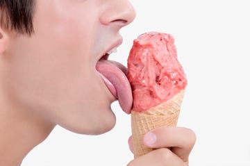 Close-up of a man licking an ice cream