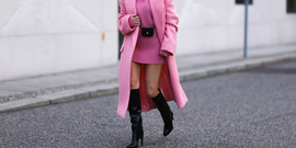 woman in a pink sweater dress and matching pink coat