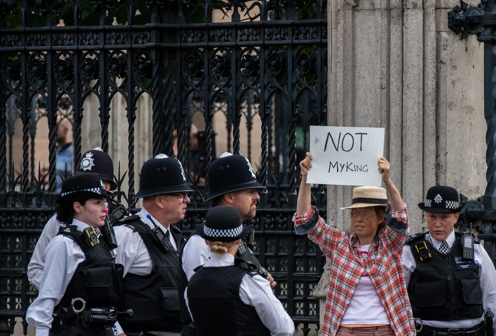 london, england   september 12 an anti monarchy protester is escorted by police outside the houses of parliament ahead of king charles address to parliament on september 12, 2022 in london, united kingdom elizabeth alexandra mary windsor was born in bruton street, mayfair, london on 21 april 1926 she married prince philip in 1947 and acceded to the throne of the united kingdom and commonwealth on 6 february 1952 after the death of her father, king george vi queen elizabeth ii died at balmoral castle in scotland on september 8, 2022, and is succeeded by her eldest son, king charles iii photo by chris j ratcliffegetty images