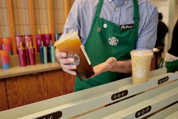 barista serving iced beverages at a starbucks