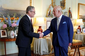 britains king charles iii r welcomes britains incoming prime minister keir starmer during an audience at buckingham palace in london on july 5, 2024, a day after britain held a general election starmer became britains new prime minister, as his centre left opposition labour party swept to a landslide general election victory, ending 14 years of right wing conservative rule photo by yui mok  pool  afp photo by yui mokpoolafp via getty images