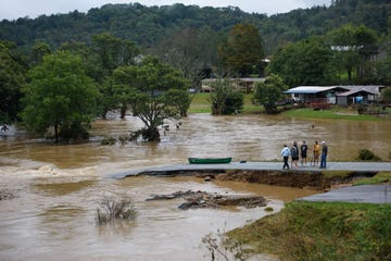 boone, north carolina september 27 friends talk after having canoed the flooded south fork new river for 32 minutes and landing at a washed out road on september 27, 2024 in boone, north carolina we saw trailers floating by, and cars toppled over, said one of the friends rains from what was hurricane helene have dropped more than a foot of rain across much of the region photo by melissa sue gerritsgetty imageses