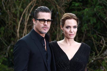 london, united kingdom may 08 brad pitt and angelina jolie attend a private reception as costumes and props from disneys maleficent are exhibited in support of great ormond street hospital at kensington palace on may 8, 2014 in london, england photo by fred duvalfilmmagic