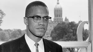 malcom x in suit and tie