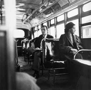 rosa parks sits in the front of a bus in montgomery, alabama, after the supreme court ruled segregation illegal on the city bus system on december 21, 1956