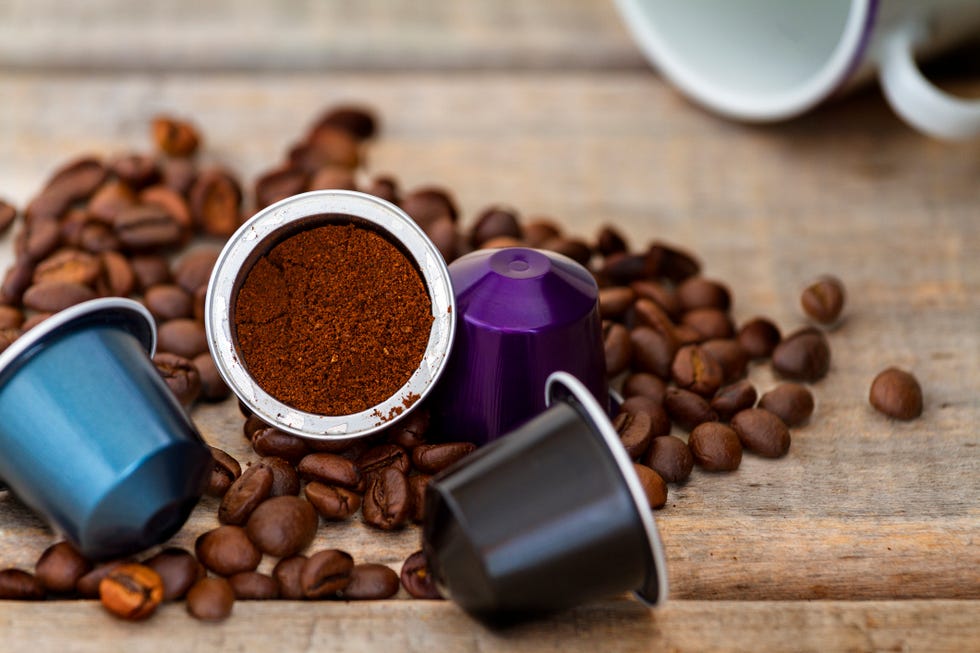 italian coffee capsules or coffee pods on wood background