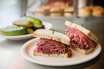 pastrami sandwich on an old fashioned deli counter with a bell