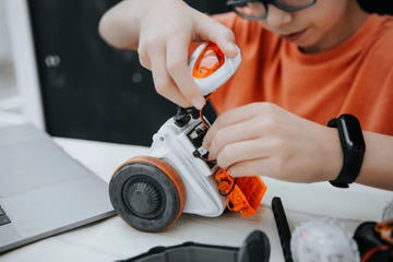 boy playing with robot toy