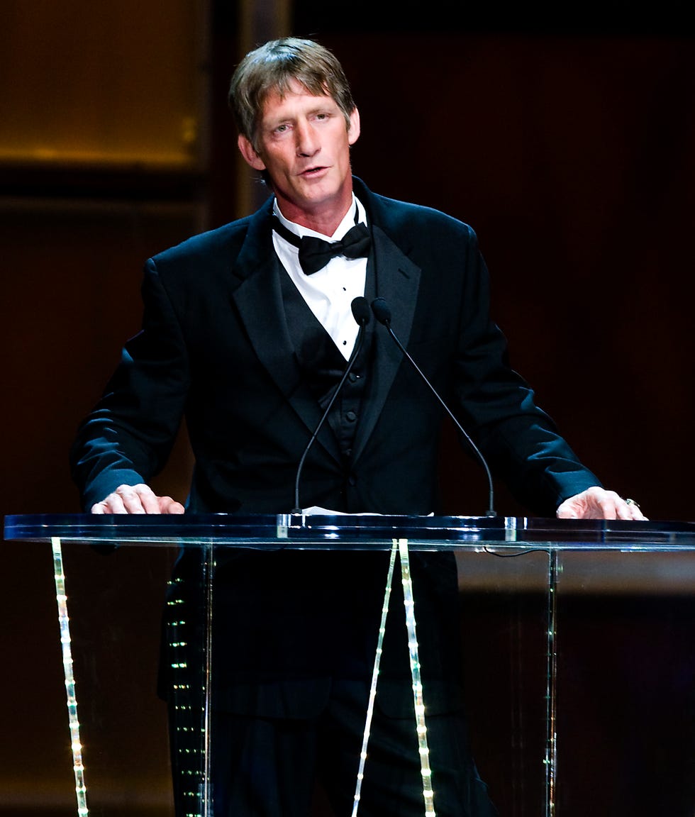 kevin von erich wearing a tuxedo and speaking at a podium