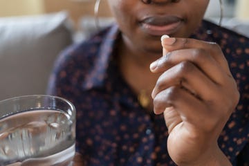 woman taking pill