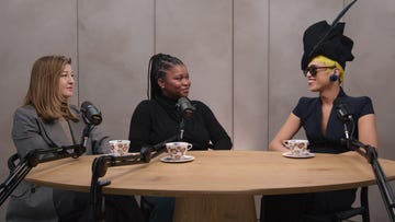 discussion among three individuals with unique styles seated at a round table