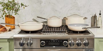 a stove top with pots and pans on it