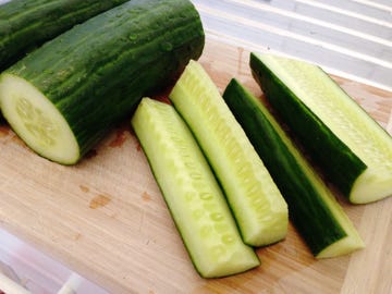 high angle view of sliced cucumber on cutting board