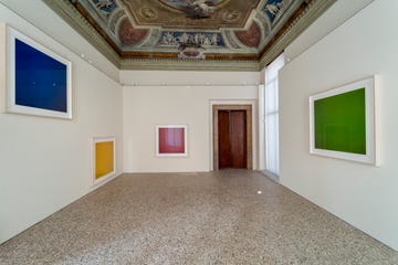 a hallway with paintings on the wall