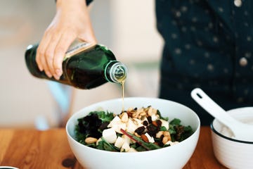 homemade gourmet food fresh green salad with mozzarella, mixed nuts and dry fruits