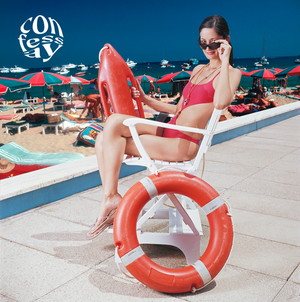 a lifeguard sitting in a chair on a beach