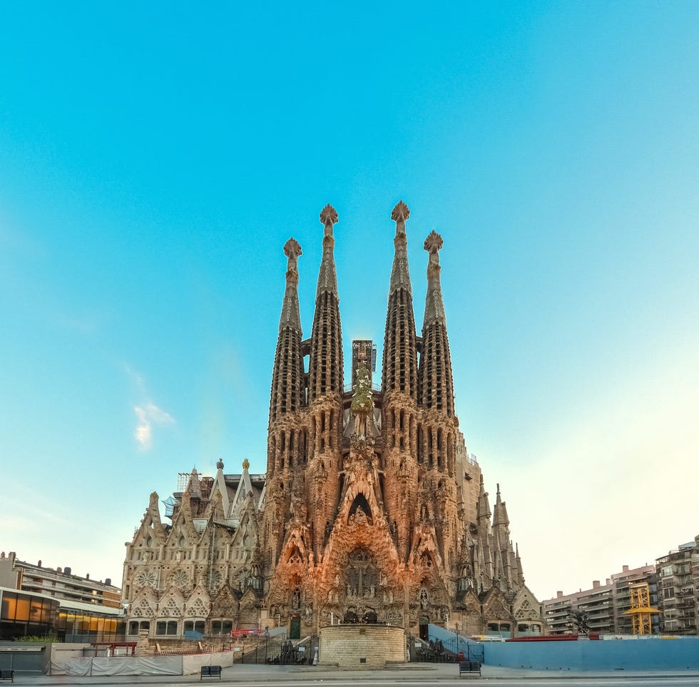 impressive facade of sagrada familia basilica at early sunset in barcelona, catalonia, spain