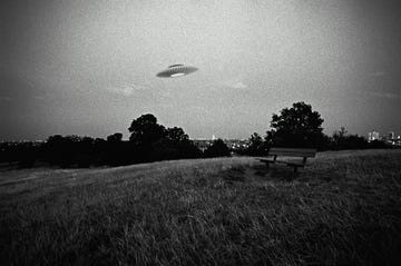 ufo in flight above urban park digital composite