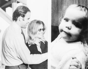 joe biden and neilia biden stand next to each other and smile, amy biden as a baby looks at the camera