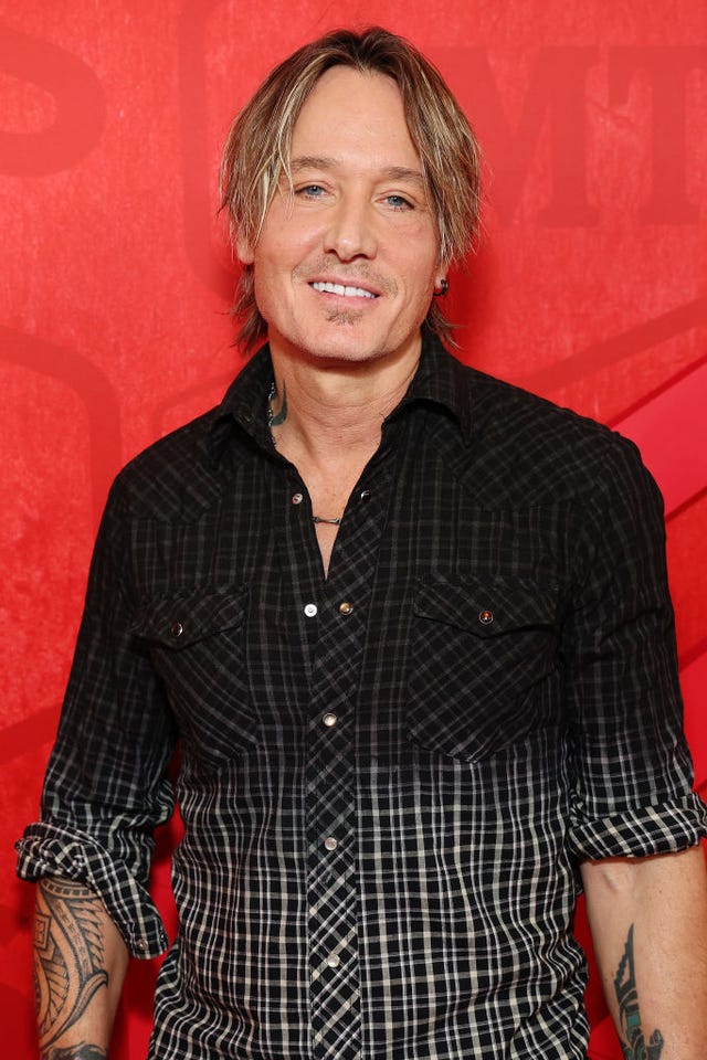 keith urban poses in plaid shirt