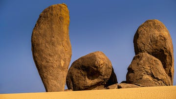 low angle view of rock formation against clear blue sky,saudi arabia