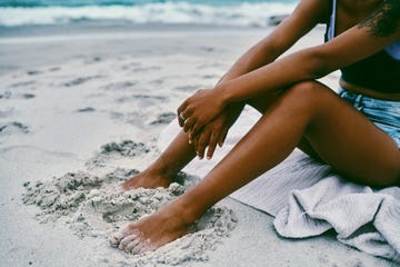 i'm just out here relaxing with my toes in the sand