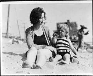 gladys baker with norma jeane baker, the future marilyn monroe, who was then around the age of 3, the pair are sitting on the sand at a beach